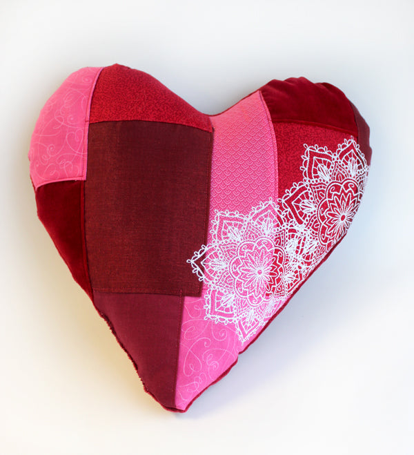 Completed Heart Patchwork Pillow project, featuring Mendhika Medallion design