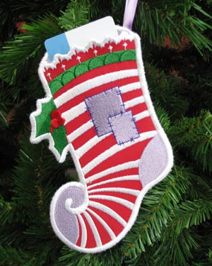 Gift Card Holder featuring Elfin Stocking (In-the-Hoop) design, hanging on a Christmas tree