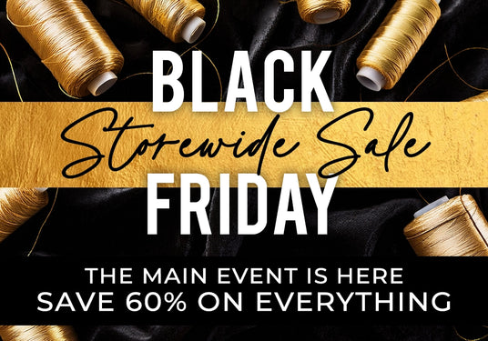 Black Friday sale advertisement with spools of thread on a black background.