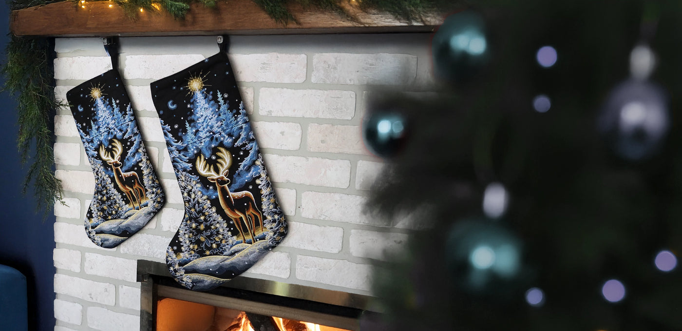 Two machine embroidered Christmas stockings with deer designs hanging above a fireplace.