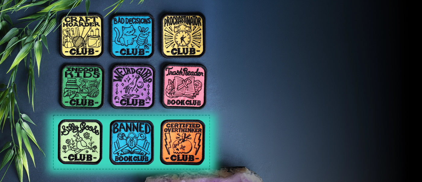 Set of colorful machine embroidery patches on a blue background