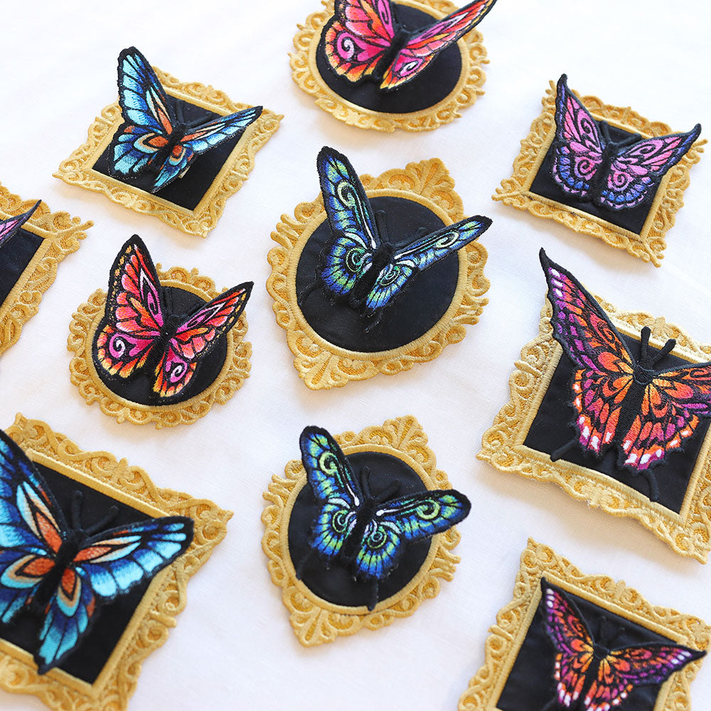 Machine embroidery freestanding butterflies and frames on a white background.