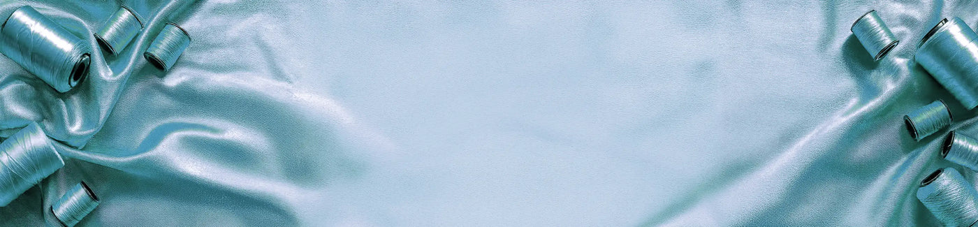 Light blue machine embroidery thread on a light blue background