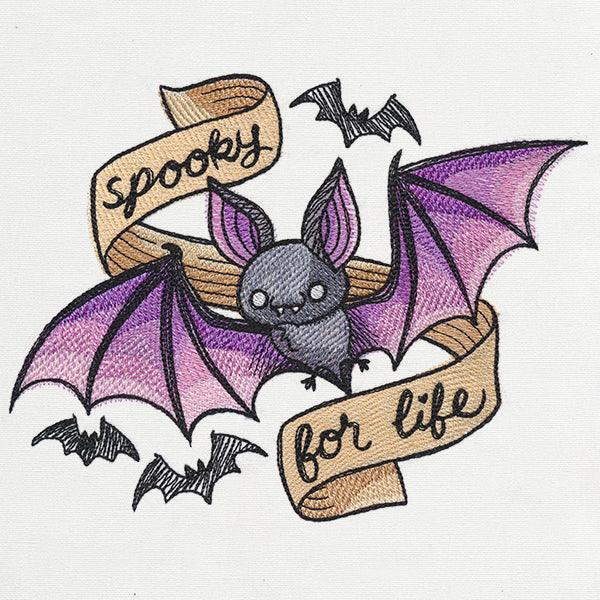 A digitally downloadable machine embroidery design of a goth bat with purple wings, a banner, and small black bat accents.