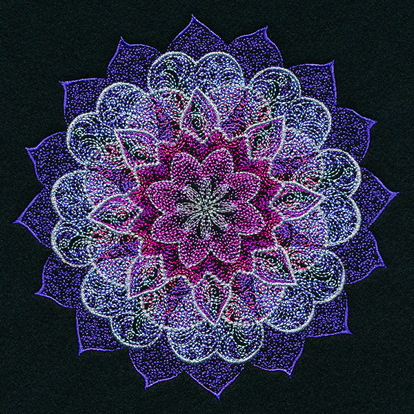 Intricate mandala embroidery design in purple, pink, and white thread on black, forming a colorful circular pattern.