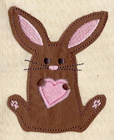 Digitally downloadable machine embroidery design of a brown bunny with pink ears and a pink heart on its chest.