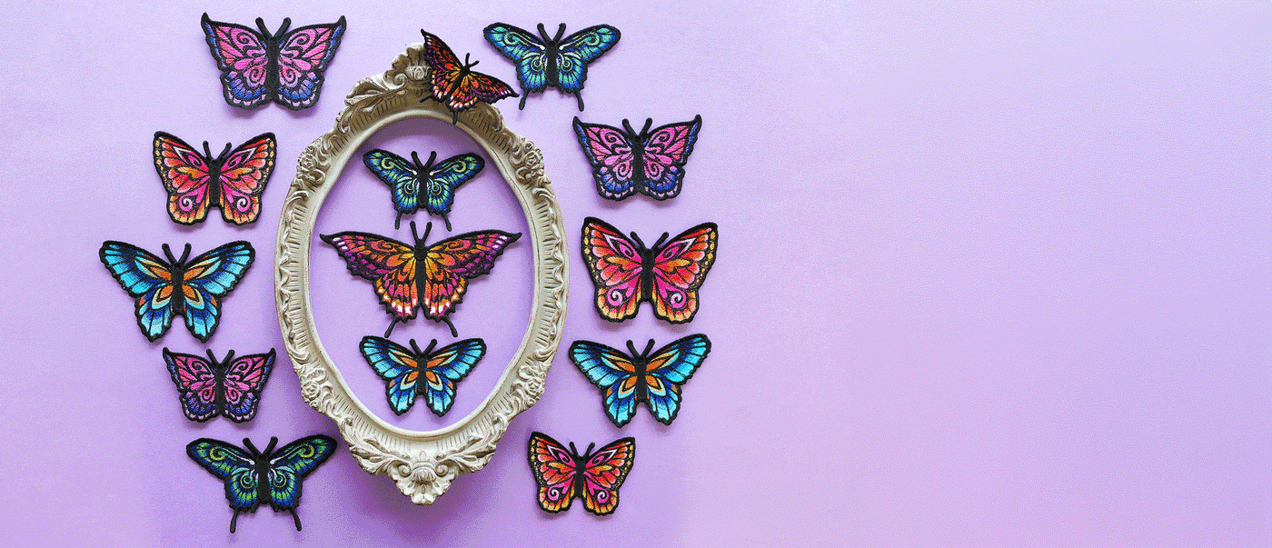 Gif of machine embroidery lace frames and freestanding butterflies on different colored backgrounds.