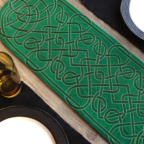 multi-piece table runner featuring machine embroidery of celtic knotwork