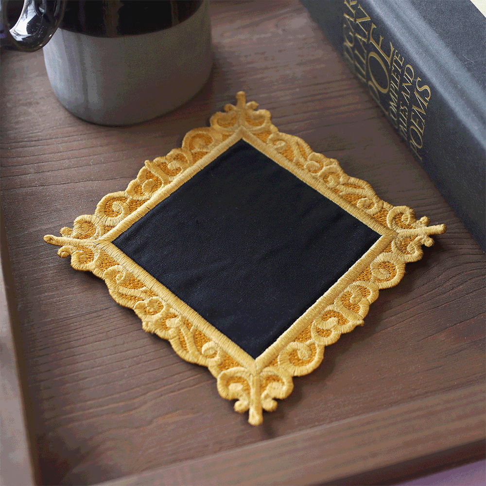 a blank machine embroidered coaster that shows multiple embroidery designs you can use