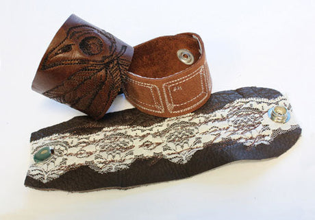 Completed Leather Cuff Bracelet project, featuring French Script 1, Avian, and Ctrl-Alt-Delete designs