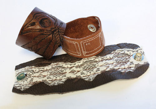 Completed Leather Cuff Bracelet project, featuring French Script 1, Avian, and Ctrl-Alt-Delete designs