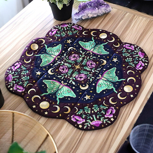 machine embroidered table center featuring luna moths
