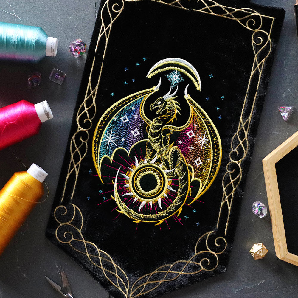 machine embroidered banner featuring a dragon and gold border designs