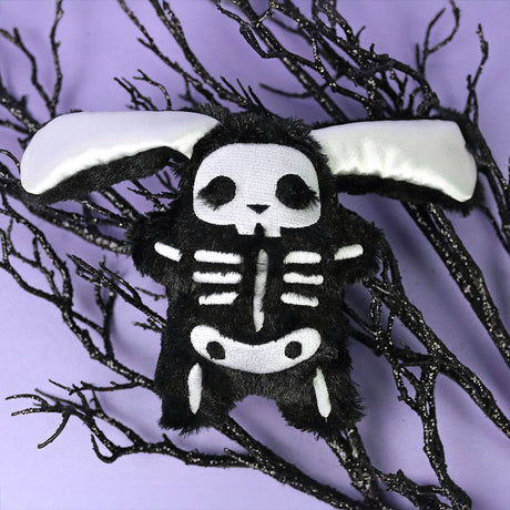 A free machine embroidery design of a Kawaii Christmas bunny ornament.