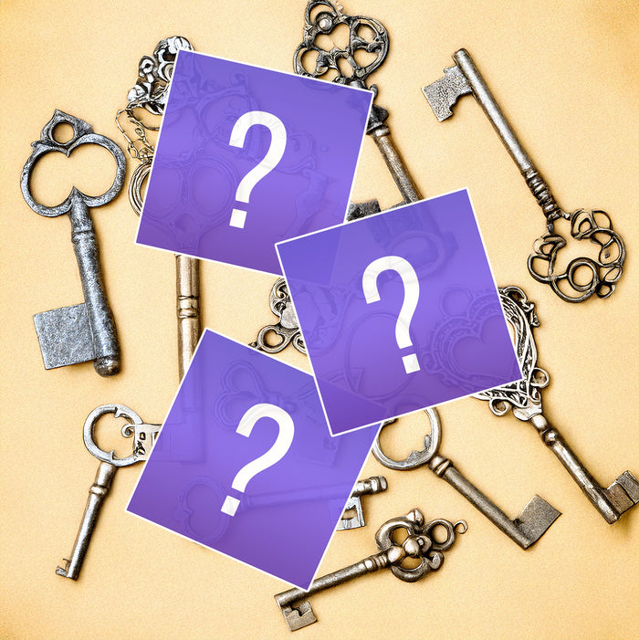 Decorative keys with purple cards featuring question marks on a beige background