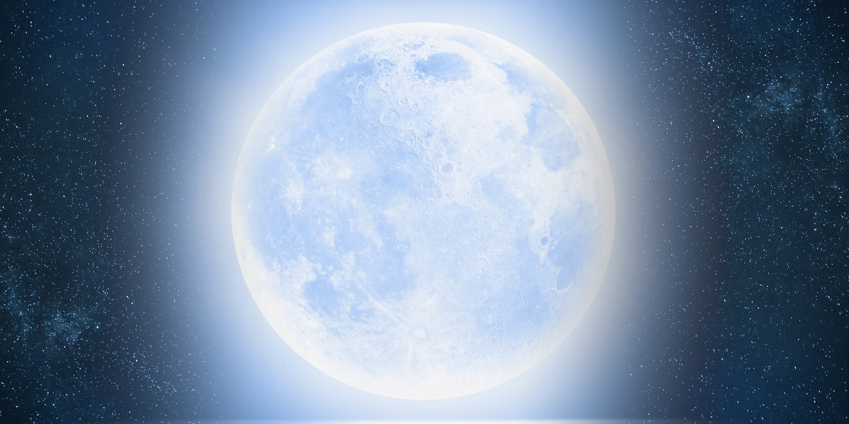 Blue moon in a starry night sky