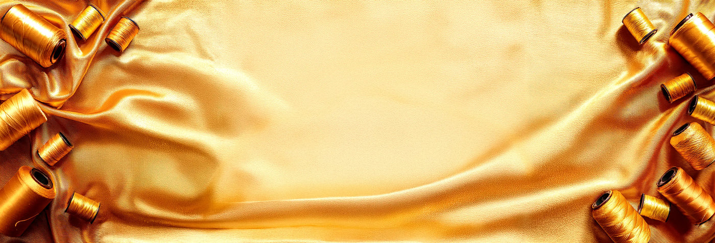 Close-up of gold ribbons and fabric with a soft focus effect