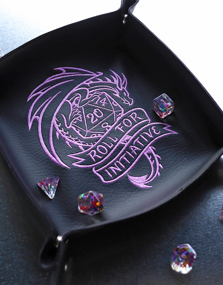 Black leather dice tray stitched with purple dragon and 20 sided dice machine embroidery design design that says "Roll for Initiative"