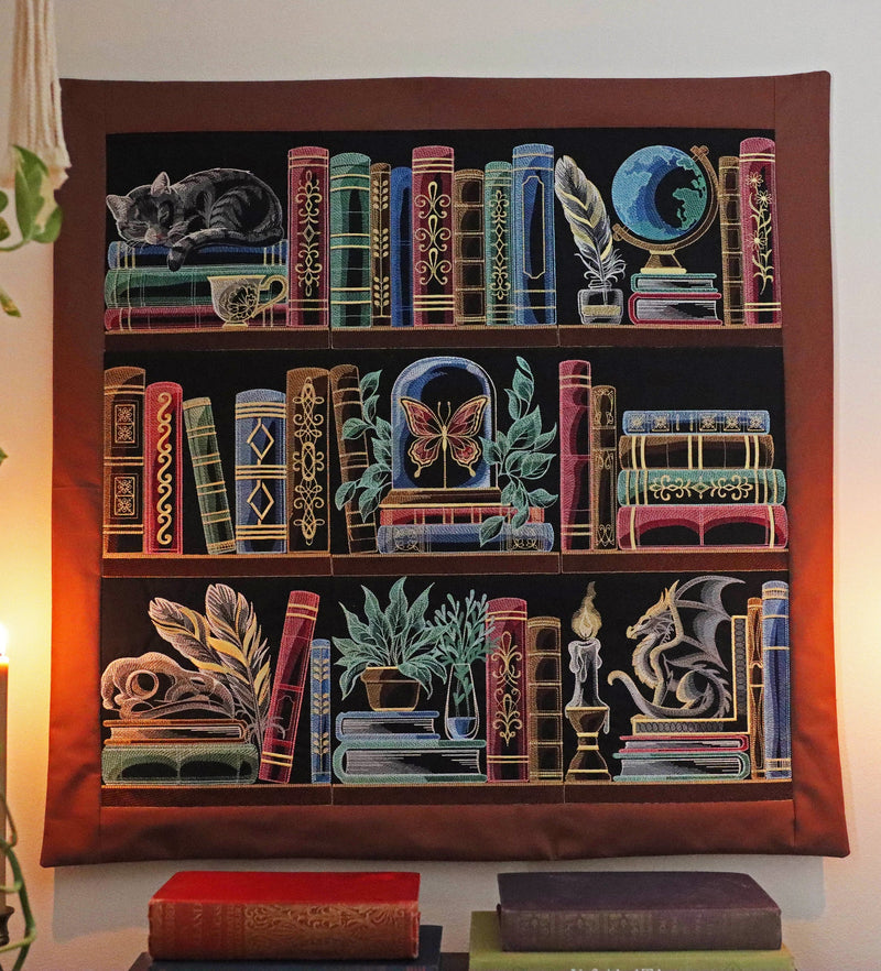 Machine embroidery bookshelf wall hanging on a white background.