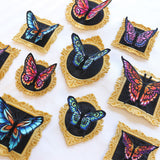 Machine embroidery freestanding butterflies and frames on a white background.