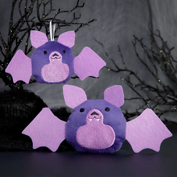 Two embroidered plush bats with fluffy details are shown. This is a digitally downloadable machine embroidery design.