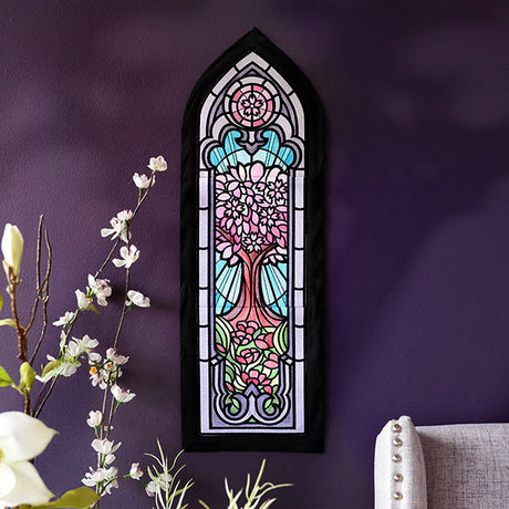 Decorative stained glass machine embroidery panel design on a purple wall with floral decorations.