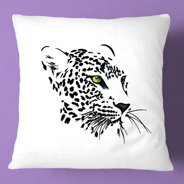 Embroidered leopard face with green eyes on a white base, digital machine embroidery design set against a purple background.