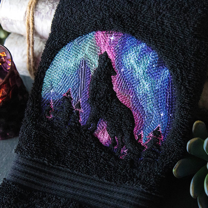 Machine embroidery embossed wolf design on black towel
