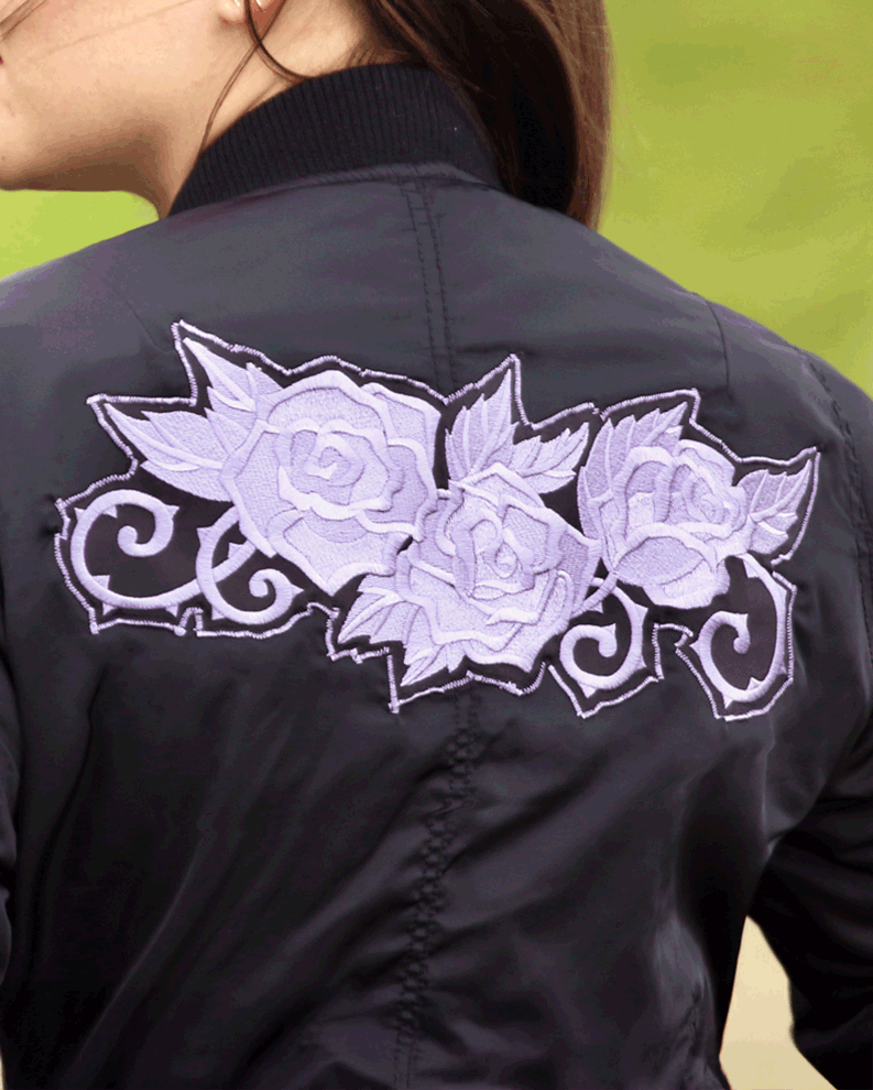 Stylish black bomber jacket decorated with a large lavender rose machine-embroidery applique with leaves perfect for DIY fashion or custom embroidery projects