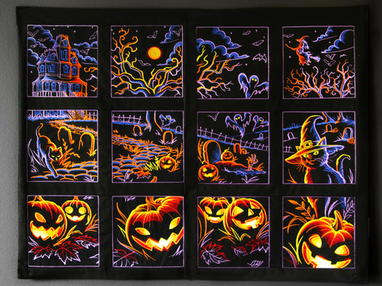 Machine embroidered Halloween-themed panel scene designs on a dark background