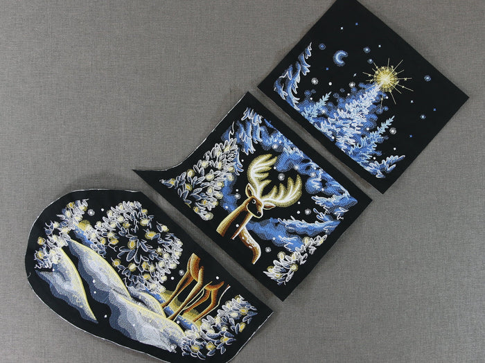 Christmas machine embroidery stocking design featuring a deer scene in three sections
