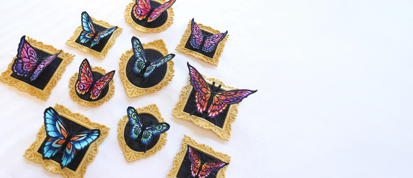 Machine embroidery 3D freestanding butterflies in lace frames on a white background