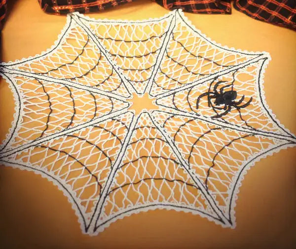 Spider web with a spider on an orange background