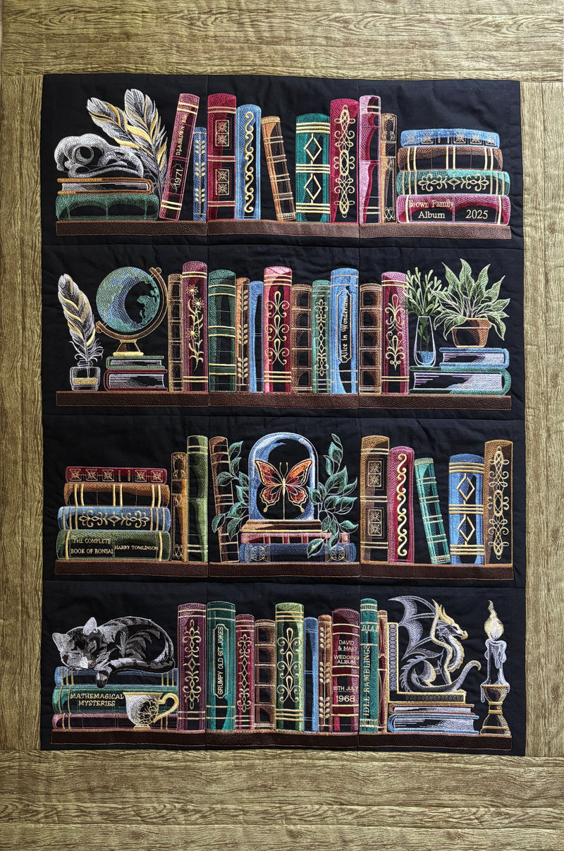 Machine embroidery bookshelf panel designs hanging on a wall.