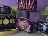video of machine embroidered zipper pouches staged in various scenes and of various construction steps.