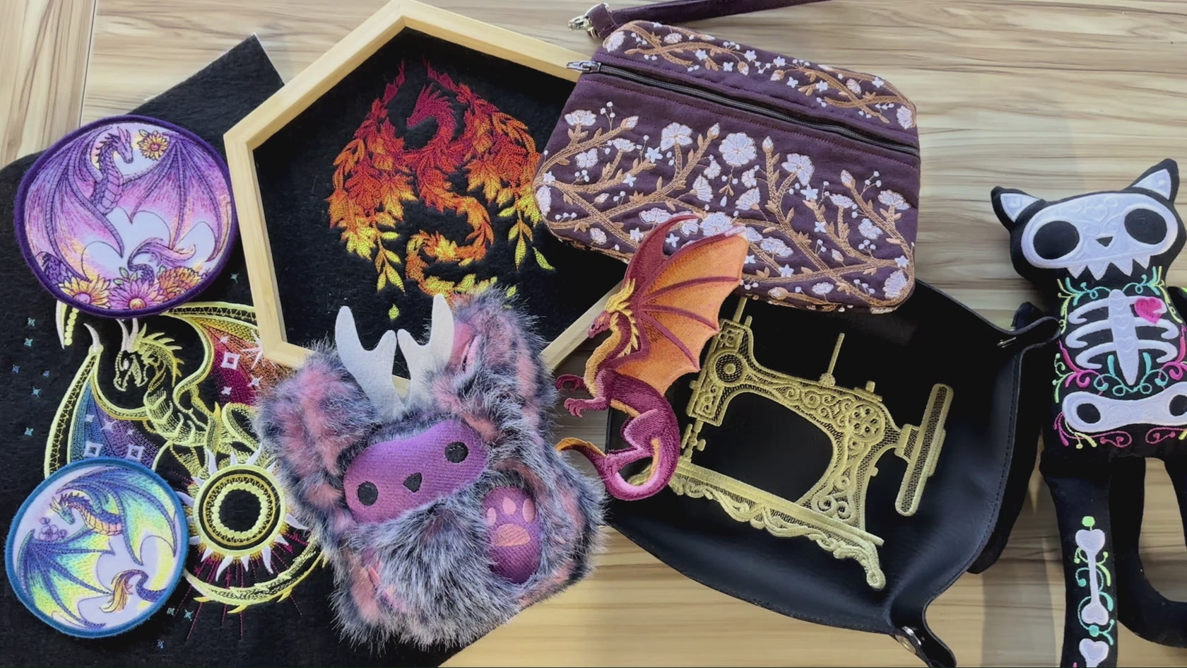 A collage of machine embroidered coasters, dragons, in-the-hoop stuffies, dice tray, zipper purse on a wooden table.